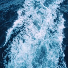 Fototapeta premium Deep Blue Ocean Water Surface, White Sea Foam, and Waves Abstract Background Texture.