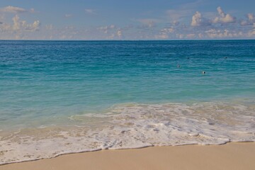Turquoise waves wash up on Grace Bay in Turks and Caicos