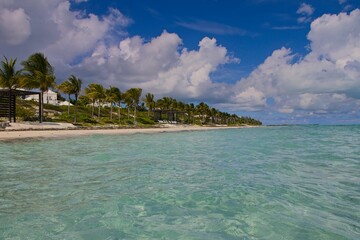 Splashing in warm, colorful blue waters of Long Bay Beach in Turks and Caicos Islands.