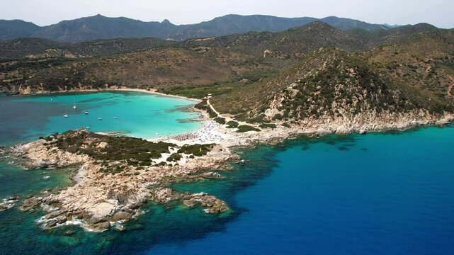 Sardegna (Sardinia) Italy. Best scenic beaches in south part. Beautiful Punta Molentis with turquoise trasparent sea and white sandy beach. Aerial drone 4k hd video
