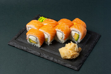 sushi on a black plate