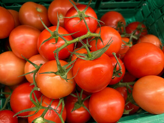 Supermarket Display Fresh Red Tomatoes On The Vine