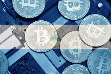 flag of nicaragua on the bitcoins with computer electronic circuit board background. bitcoin...