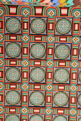 Vibrant and detailed display of traditional korean roof design, showcasing colorful geometric patterns and intricate artistry