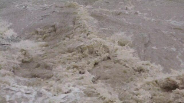 a massive flood transforms a peaceful riverbank
