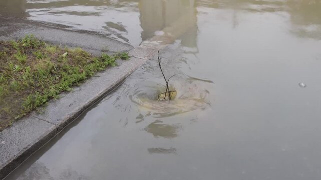 a road flooded by rain in a city during a flood in