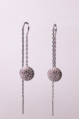 Elegant Silver Chain Earrings with Crystal Detailing on White Background