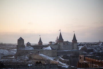 A wonderful historical castle at sunset in Ukraine. The city of Kamianets-Podilskyi.