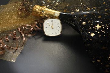 New Year concept, with bright light and champagne bottles, abstract bokeh background