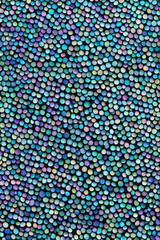 A colorful, seamless texture of iridescent sequins, forming a dynamic, glossy pattern that adds depth and elegance. Ideal for fashion, decor, or textile design. Generative AI