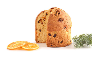 Cut Panettone with dried orange slices and Christmas tree branch on white background