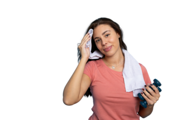 Confident young woman training with light weights