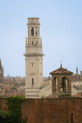 Church bell and a church tower in the background in Verona, Italy
