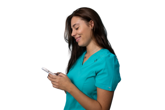 Portrait of a young nurse in scrubs using a smartphone - Powered by Adobe