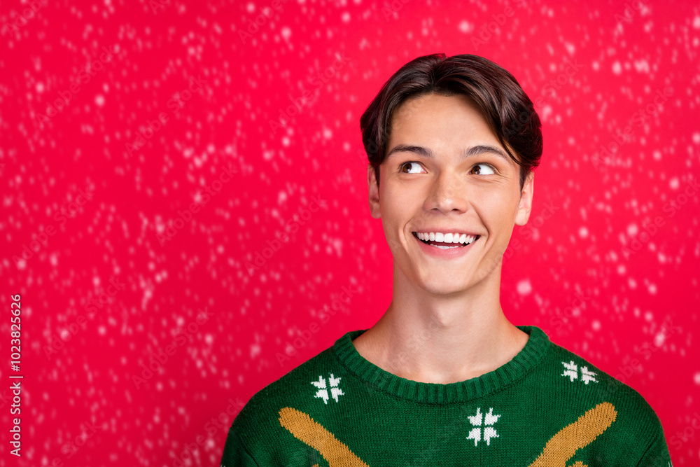 Poster Photo of excited funny creative guy dream think look empty space wear ugly sweater isolated red color background