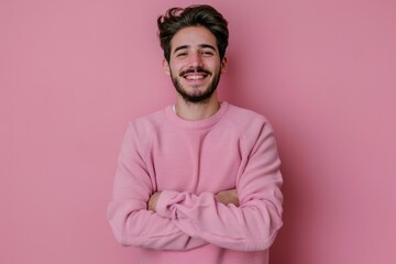Fototapeta premium Happy young man in casual sweater with crossed arms.