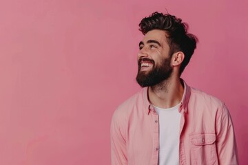 Fototapeta premium Confident young man in casual shirt smiling and looking away.