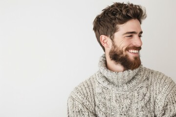 Fototapeta premium Handsome man in casual sweater smiling confidently.