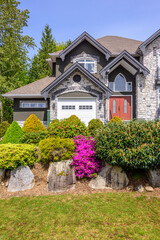 Fragment of a luxury house with a garage door in Vancouver, Canada. Horizontal orientation.