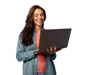 Smiling girl holding a laptop in her hands