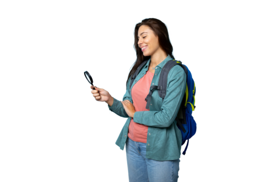 Portrait of a young female hiker with a magnifying glass and backpack