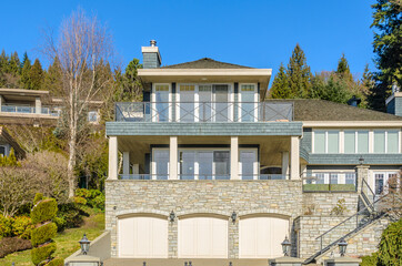 Fragment of a luxury house with a garage door in Vancouver, Canada. Horizontal orientation.