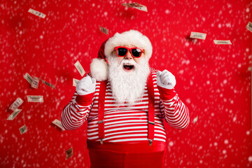 Photo of pensioner old man grey beard raise fists open mouth money shower wear santa x-mas costume...