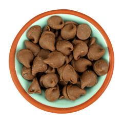 Bowl filled with milk chocolate chips isolated on a white background.