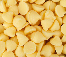 Overhead close view of a portion of white baking chips.