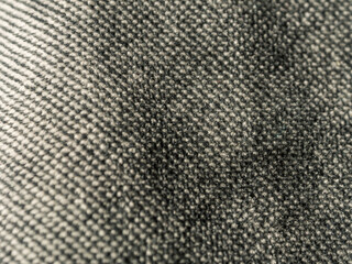 Macro photography of fabric texture, detailing soft waves and patterns, creating an impression of tactile comfort and artistic elegance