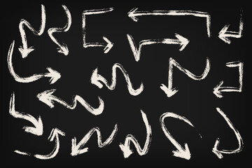 Hand drawn arrows with chalk effect. Hand drawn set of doodle arrow icons isolated on black background. Collection of hand free curved lines and pointers.