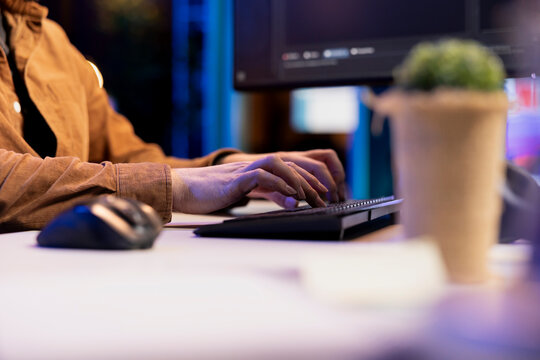 Computer technician typing lines of code on keyboard, futureproofing company network from downtimes and unexpected system failures. IT expert writing script increasing data security, close up