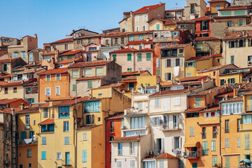 Colourful bright facades of the city of Menton on a sunny day