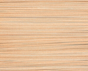 Macro photography of raw soba, buckwheat noodles; Japanese dish; ashen brown colour, grainy texture noodle; wheat; traditional food