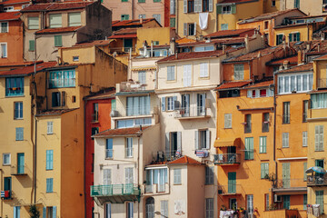 Fototapeta premium Colourful bright facades of the city of Menton on a sunny day