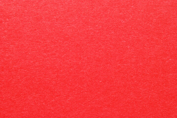 A sheet of red color cardboard texture as background