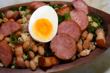 TROPEIRO BEANS, A TRADITIONAL DISH OF BRAZILIAN CUISINE FROM THE STATE OF MINAS GERAIS