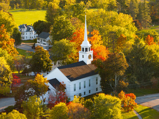 Aerial landscape view of church tower in autumn season