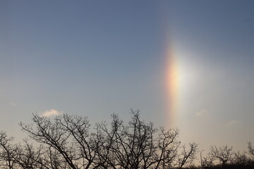 brilliant sundog at sunrise on a frozen winter morning