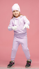 Child in Purple Activewear Poses in Studio