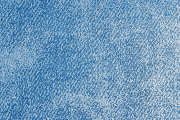 Detailed view of blue grunge shabby jeans denim fabric texture. Closeup, macro of diagonal weaving cloth, canvas surface background. Textile for decor, upholstery, garment. Wallpaper, backdrop.