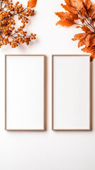 Obraz premium Two empty frames with autumn leaves on a white background.