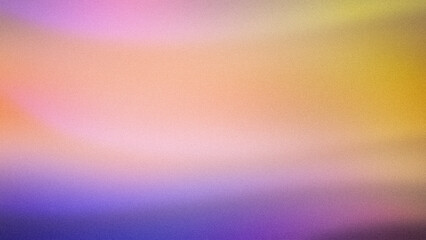 Obraz premium A soft abstract gradient blending pastel tones of orange, pink, yellow, and purple, featuring a grainy texture. Perfect for creative wallpapers, light backdrops, and modern designs