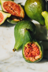 green figs with a bite taken out of one