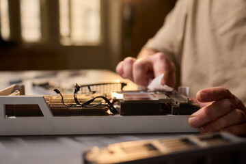 Hand Repairing a Graphics Card through the Application of Thermal Paste for Better Performance