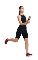 Athletic woman in sportswear running on white background