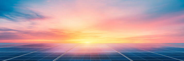 Obraz premium Solar panels at sunset with a bright, colorful sky.