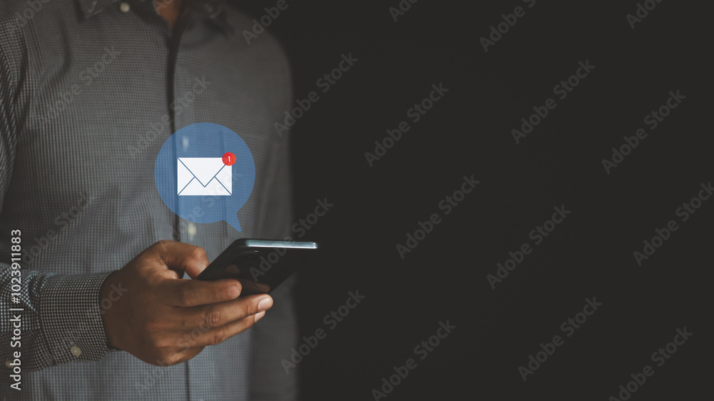 Aufkleber email marketing concept. hand of a businessman using a smartphone for an email with notification ale
