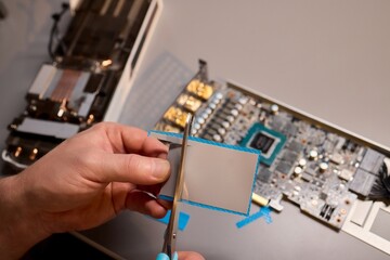 Hand Repairing a Graphics Card through the Application of Thermal Paste for Better Performance