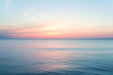 Fototapeta premium pastel sunset colors on ocean, horizon line in the middle of the frame.